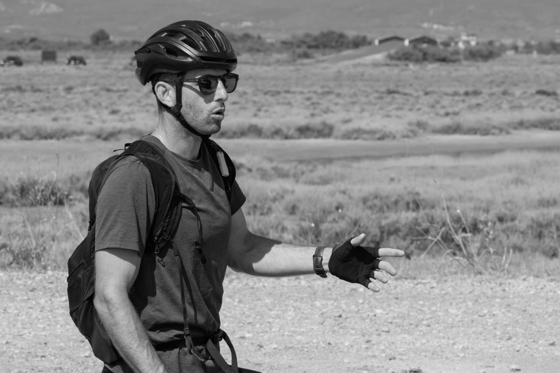 Cyclist with an open hand while riding gravel, Gruissan